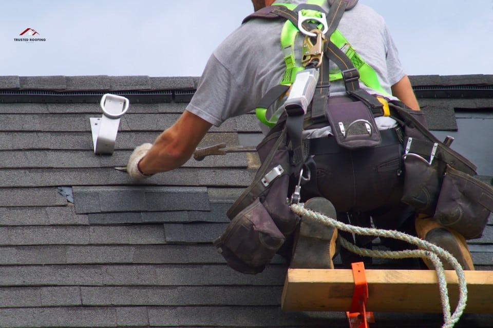 About - Trusted Roofing Services working on a roofing repair